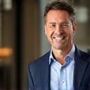 Headshot of John P., a financial analyst in Boston, smiling confidently.